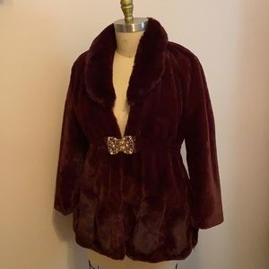 Burgundy faux fur coat w/ gold metal piece closure, and elastic waist band
